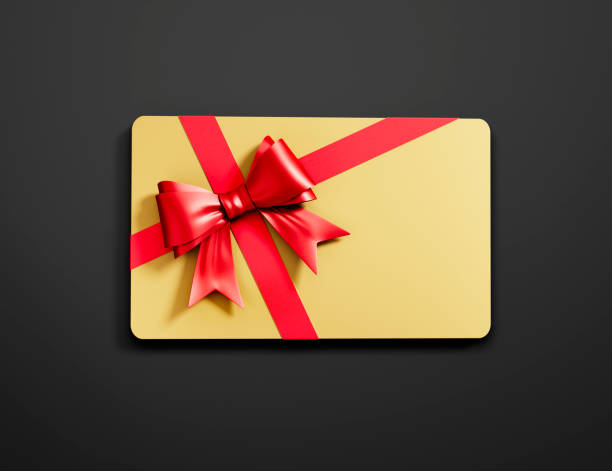 Golden Gift Card with red tied Bow on dark background