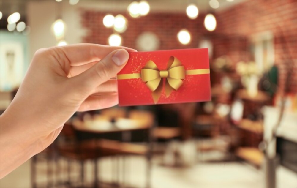 a male hand holidng a gift box