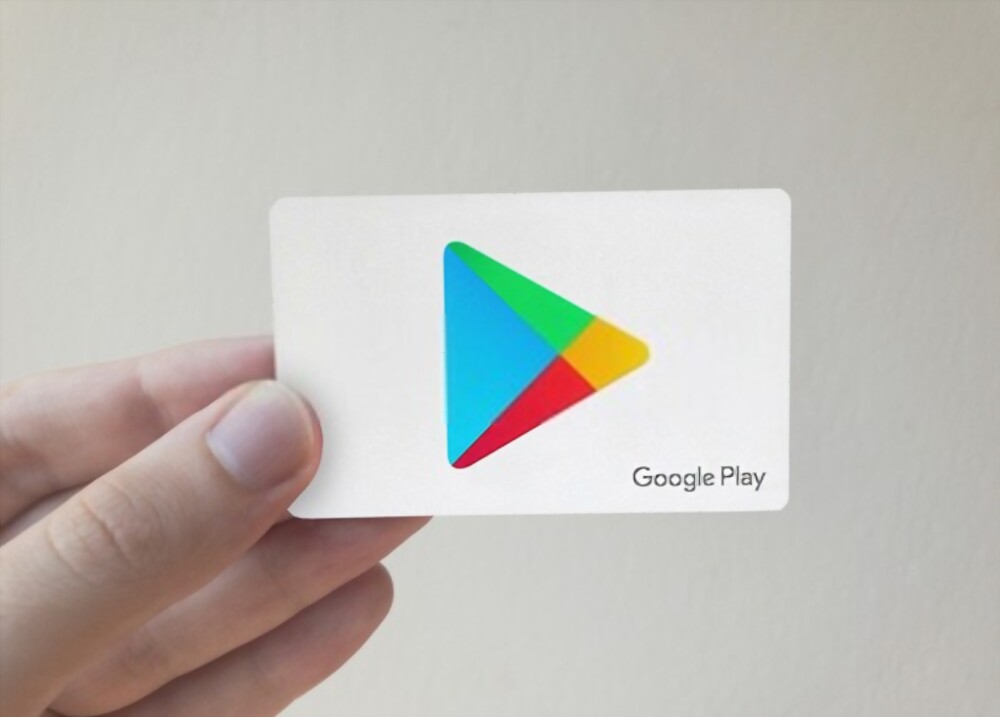 someone holding a Google Play card