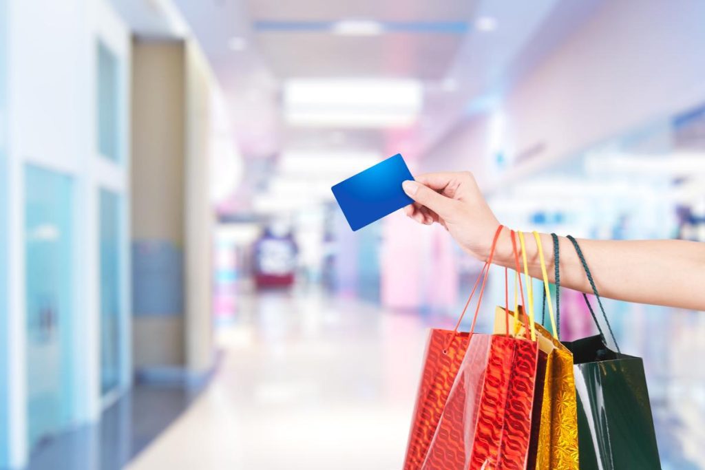 a woman shopping with a card
