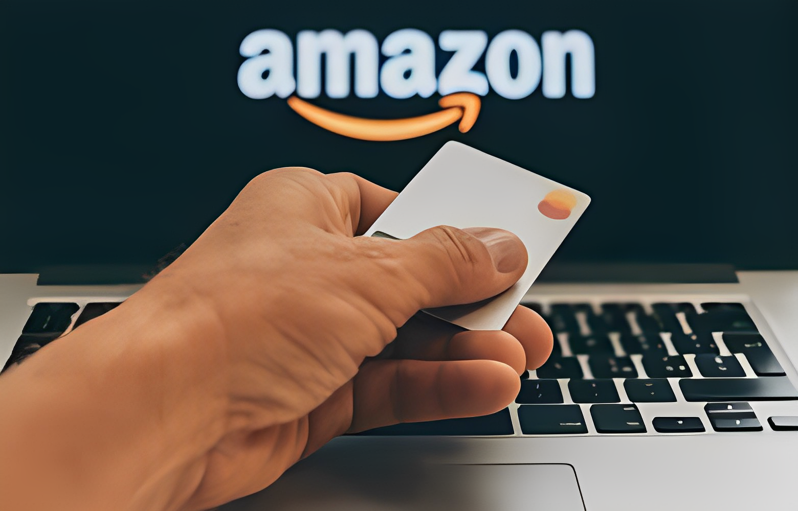 A man holding Amazon card